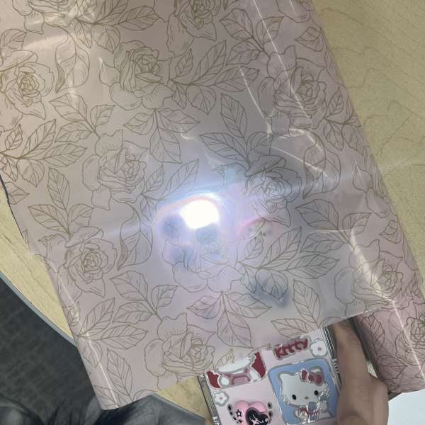 Testing light diffusion using gift wrap to explore how the LED shines through the material.